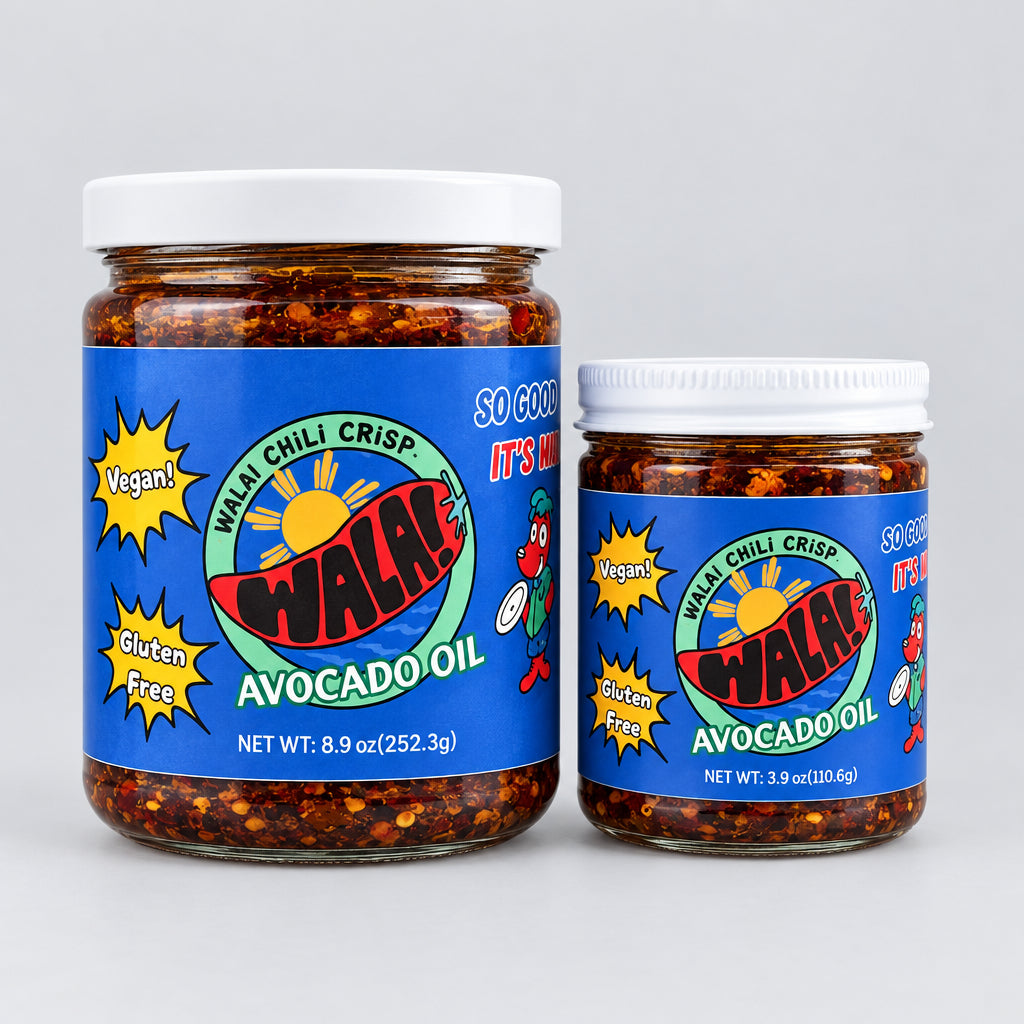 Two Wala! Avocado Oil Chili Crisp jars with blue labels on a wooden surface